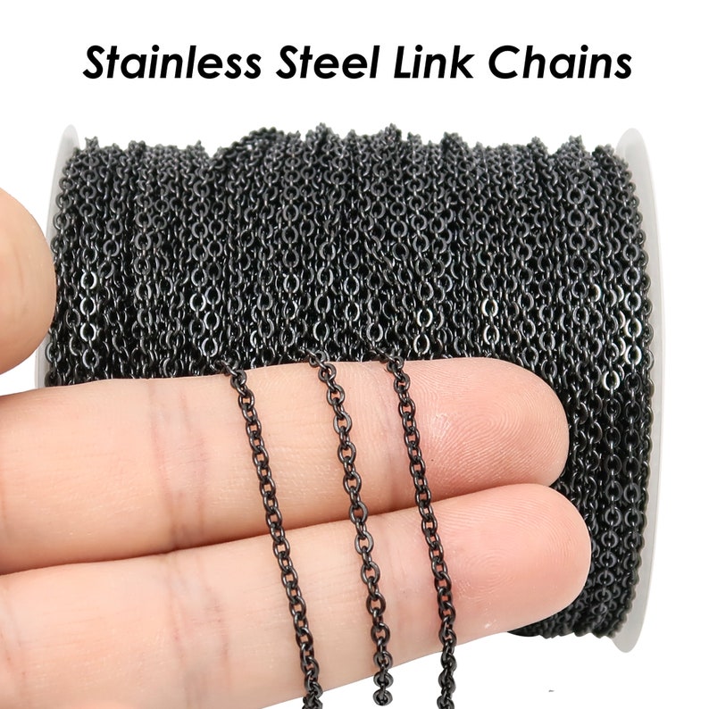 May include: A spool of black stainless steel link chain. The chain is shown in a close-up with a hand holding three strands of the chain.