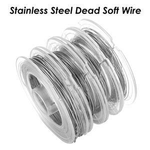 May include: A spool of silver-colored stainless steel dead soft wire. The wire is wound around a clear plastic spool.