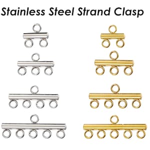 May include: Four different sizes of stainless steel strand clasps. The clasps are silver and gold in colour and have multiple loops for attaching strands of beads or other jewellery components.