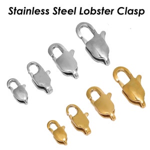 May include: Stainless steel lobster clasps in various sizes. The clasps are silver and gold-colored, with a secure, spring-loaded closure. The text "Stainless Steel Lobster Clasp" is displayed at the top of the image.