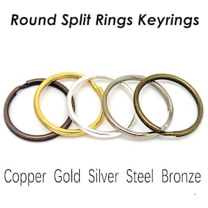 May include: A collection of round split rings in copper, gold, silver, steel, and bronze. The image includes the text "Round Split Rings Keyrings" and "Copper Gold Silver Steel Bronze". These keyrings are ideal for organizing keys or crafting.