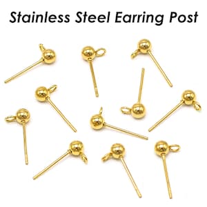 Może przedstawiać: Zbliżenie na dziesięć złotych, stalowych sztyftów do kolczyków. Sztyfty są okrągłe i mają małą pętelkę na górze.