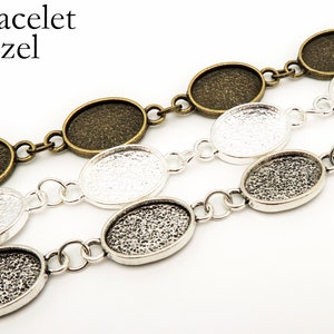 May include: Bracelet bezels in antique bronze, silver, and gunmetal finishes. The oval-shaped bezels are linked together with small chain links. The text "Bracelet Bezel" is in the upper left corner.