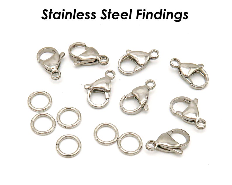 May include: A collection of silver-toned metal clasps and jump rings. The clasps are lobster claw style and the jump rings are round.  Stainless Steel Findings.