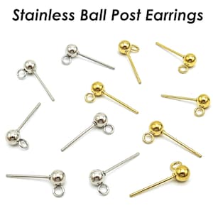 May include: Stainless steel and gold-coloured ball post earrings with a small loop for attaching charms. The earrings have a ball at the end of the post. The text "Stainless Ball Post Earrings" is at the top of the image.