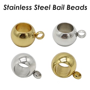 May include: Four stainless steel bail beads, two gold and two silver. Each bead has a round shape with a hole in the center and a small loop on the side.