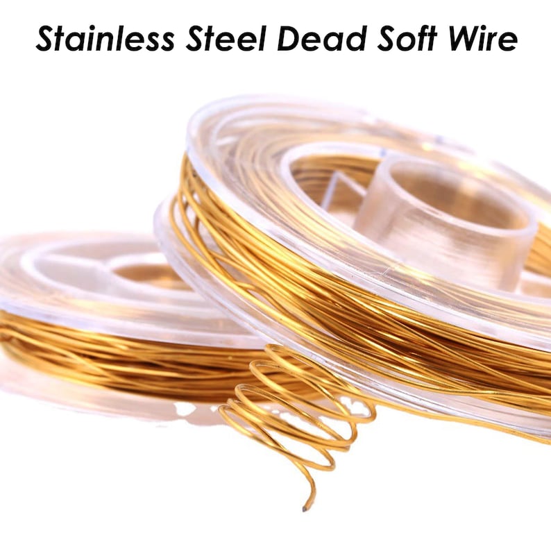 May include: Two spools of gold-colored stainless steel dead soft wire. The wire is wound around clear plastic spools.