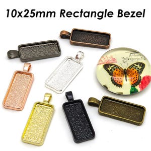 May include: Assortment of 10x25mm rectangle metal bezels in various finishes, including silver, gold, black, and bronze. The bezels have a smooth, polished surface and are ideal for crafting jewelry or other decorative projects.