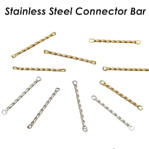 May include: A collection of gold and silver twisted metal connector bars. The bars have two loops on each end. The bars are approximately 2.5 cm long.