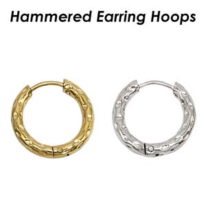 May include: A pair of hammered hoop earrings, one gold and one silver.
