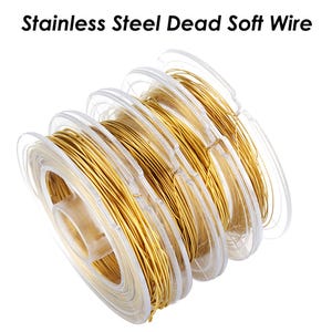 May include: A spool of gold-colored stainless steel dead soft wire. The wire is wound around a clear plastic spool.