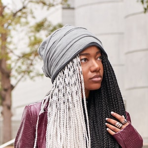 African American female model wearing grey layered slouchy beanie during summer