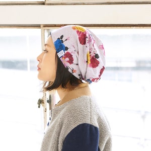 Japanese woman wearing a flower printed slouchy beanie
