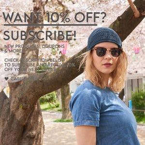 May include: A dark blue knit beanie with a textured pattern worn with brown-rimmed sunglasses and a blue denim shirt. The image includes text: WANT 10% OFF? SUBSCRIBE! NEW PRODUCTS, COUPONS & MORE! CHECK DESCRIPTION BELOW TO SUBSCRIBE AND CASUALBOX.
