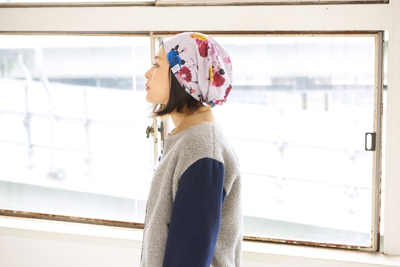 Japanese woman wearing a flower printed slouchy beanie