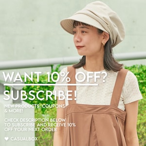 May include: A person wearing a beige hat and brown overalls over a white lace top. The image includes text that says "WANT 10% OFF? SUBSCRIBE!" and "NEW PRODUCTS, COUPONS & MORE!" The Casualbox logo is also visible.