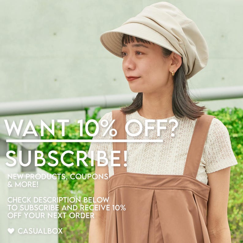 May include: A person wearing a beige hat and brown overalls over a white lace top. The image includes text that says "WANT 10% OFF? SUBSCRIBE!" and "NEW PRODUCTS, COUPONS & MORE!" The Casualbox logo is also visible.
