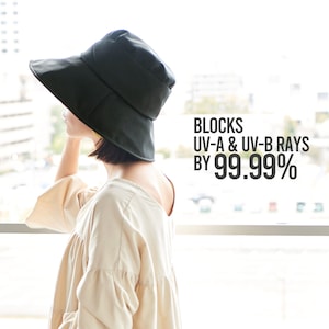 May include: A black wide-brimmed sun hat with a fold-down crown. The hat blocks UV-A & UV-B rays by 99.99%.