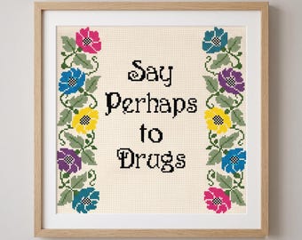 Patrón de punto de cruz "Di quizás a las drogas" en PDF, gráfico de muestrario floral subversivo, cita sarcástica y divertida.