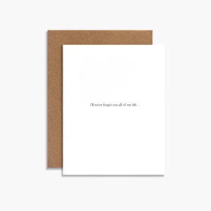 May include: A white card with a brown envelope. The card has the text "I'll never forget you all of my life." printed on it.