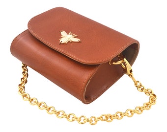 Hand made luxury leather cross body mini clutch / belt bag. With chain strap, closes with magnet locks
