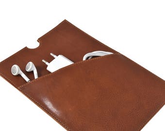 Hand made luxury leather iPad mini / e-reader cover of top quality cognac leather. With pocket on front for earphones and cables