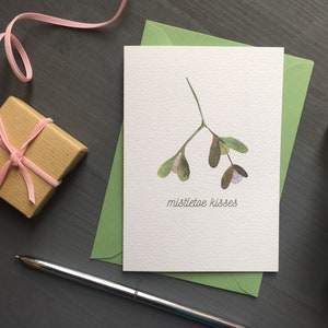 Carte de Noël romantique bisous du gui