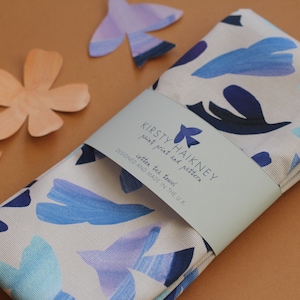 Dove patterned tea towel in periwinkle and lilac, bird tea towel