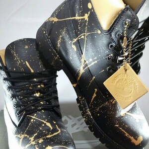 black timbs with gold chains