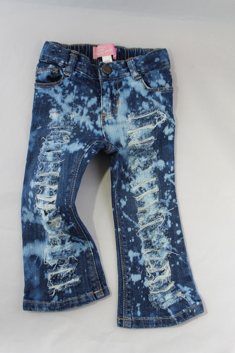 ripped jeans with chains on them