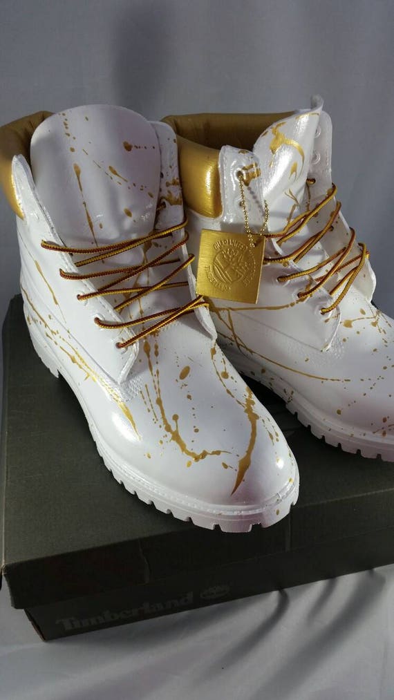 white and gold timbs