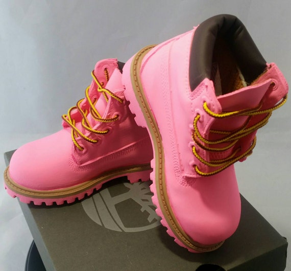 pink timbs with bow