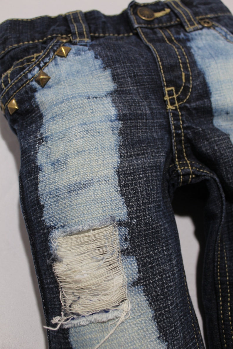 distressed jeans with chains