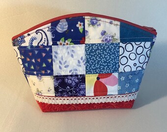 Quilted patchwork zipper pouch bag.  Makeup bag, cosmetics or travel bag. Reds and blues . Free shipping