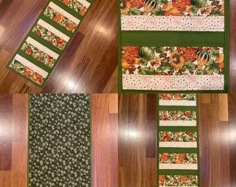 Fall Autumn quilted table runner with pumpkin and squash print and leaves. 13.5” x 39”. Free shipping