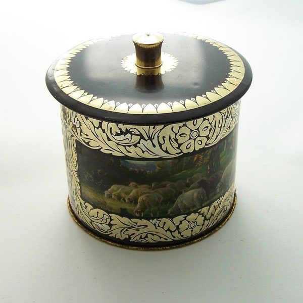 Round tin box with lid romantic landscapes gilded leaves embossed on black back ground vintage biscuits box 1960 Made in France