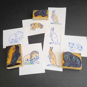 3 Old-School-Stempel auf Holz montiert: Löwe, Tiger und Känguru, Vintage-Savannentiere