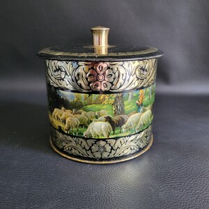 Round tin box with lid "Sheep and the sheperdess" landscapes gilded leaves embossed on black back ground vintage biscuits box Made in France