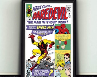 May include: Framed comic book cover featuring Daredevil, Spider-Man, and the Fantastic Four. The artwork is vibrant with bold colors and dynamic action poses. Text includes "Here Comes Daredevil" and "The Man Without Fear!"