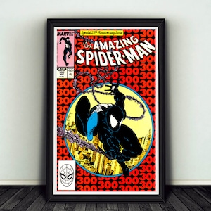 May include: Framed comic book cover of The Amazing Spider-Man, issue 300, featuring Spider-Man in a black suit. The cover has a red background with the number 300 repeated. The Marvel logo and issue details are visible.
