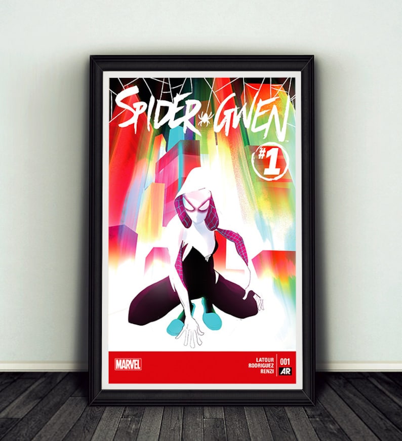 May include: Framed Spider-Gwen comic book art. The artwork features a stylized illustration of Spider-Gwen in a crouching pose, set against a colorful cityscape. The title "Spider Gwen" is prominently displayed, along with the Marvel logo.