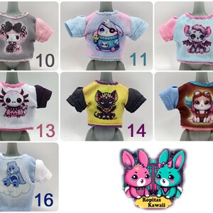 K&ouml;nnte beinhalten: Eine Sammlung von T-Shirts f&uuml;r Puppen mit verschiedenen Cartoon-Tierdesigns. Jedes Shirt hat kurze &Auml;rmel und ein einzigartiges Motiv, darunter eine Katze, ein Axolotl und ein Hase. Die Farbpalette umfasst Rosa, Blau, Gelb und Grau.