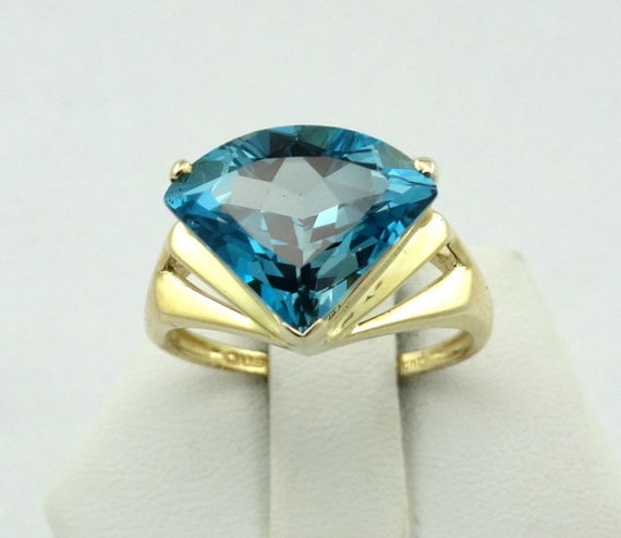 Stunning Fantasy Cut London Blue Topaz in a 10K Yellow Gold Ring
