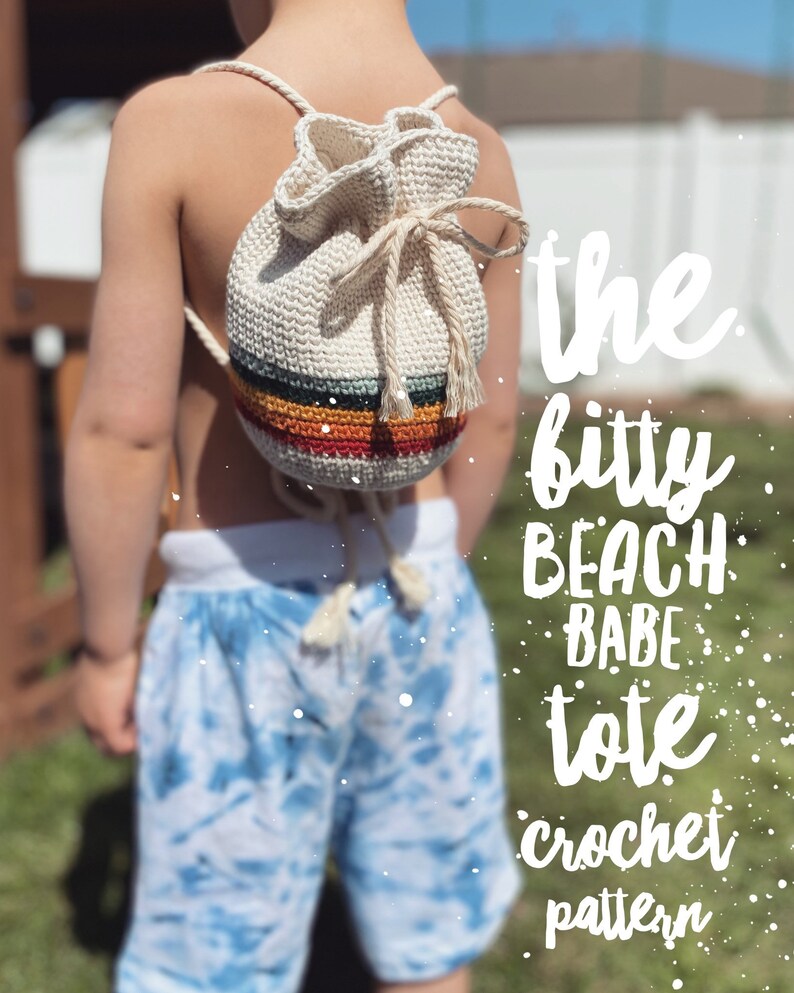 May include: A white crocheted tote bag with colorful stripes, worn as a backpack by a child. The text "the bitty beach babe tote crochet pattern" is superimposed on the image.