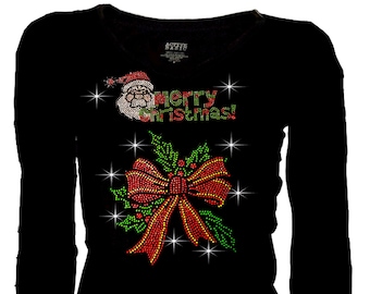 May include: Black long-sleeved shirt featuring a red and green bow, holly leaves, and the words "Merry Christmas!" in rhinestones.