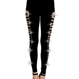 May include: Black leggings with side slits and rhinestone embellishments.