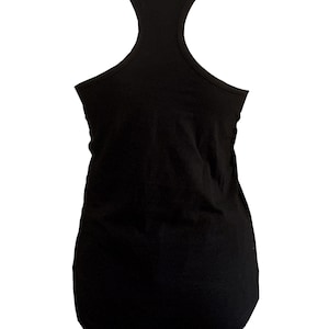 May include: A black racerback tank top. The sleeveless top has a scoop neck and a rounded hem. The back features a distinctive Y-shaped design. The tank top is made of a soft, opaque fabric.
