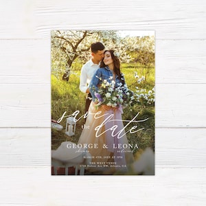May include: Save the date card with a photo of a couple in a field with a floral background. The text reads "Save the Date" with the couple's names "George & Leona" and the date "March 4th, 20XX at 3PM". The venue is "The West Venue" and the address is "1710 Defour Ave NW, Atlanta, GA".