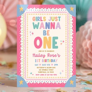 May include: A rectangular birthday invitation card with a cream background, featuring the colorful text GIRLS JUST WANNA BE ONE, Hailey Rose's 1ST BIRTHDAY, and event details. The border is pink, blue, and yellow with star and scalloped patterns.
