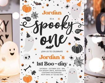 May include: A rectangular Halloween-themed invitation card featuring the text Jordan is a spooky one, Join us to celebrate Jordan's 1st Boo-day, Saturday October 12th 5pm, 1234 Spooky Drive, Boston 5678, Costumes encouraged, RSVP Emma at 123-456-7890.